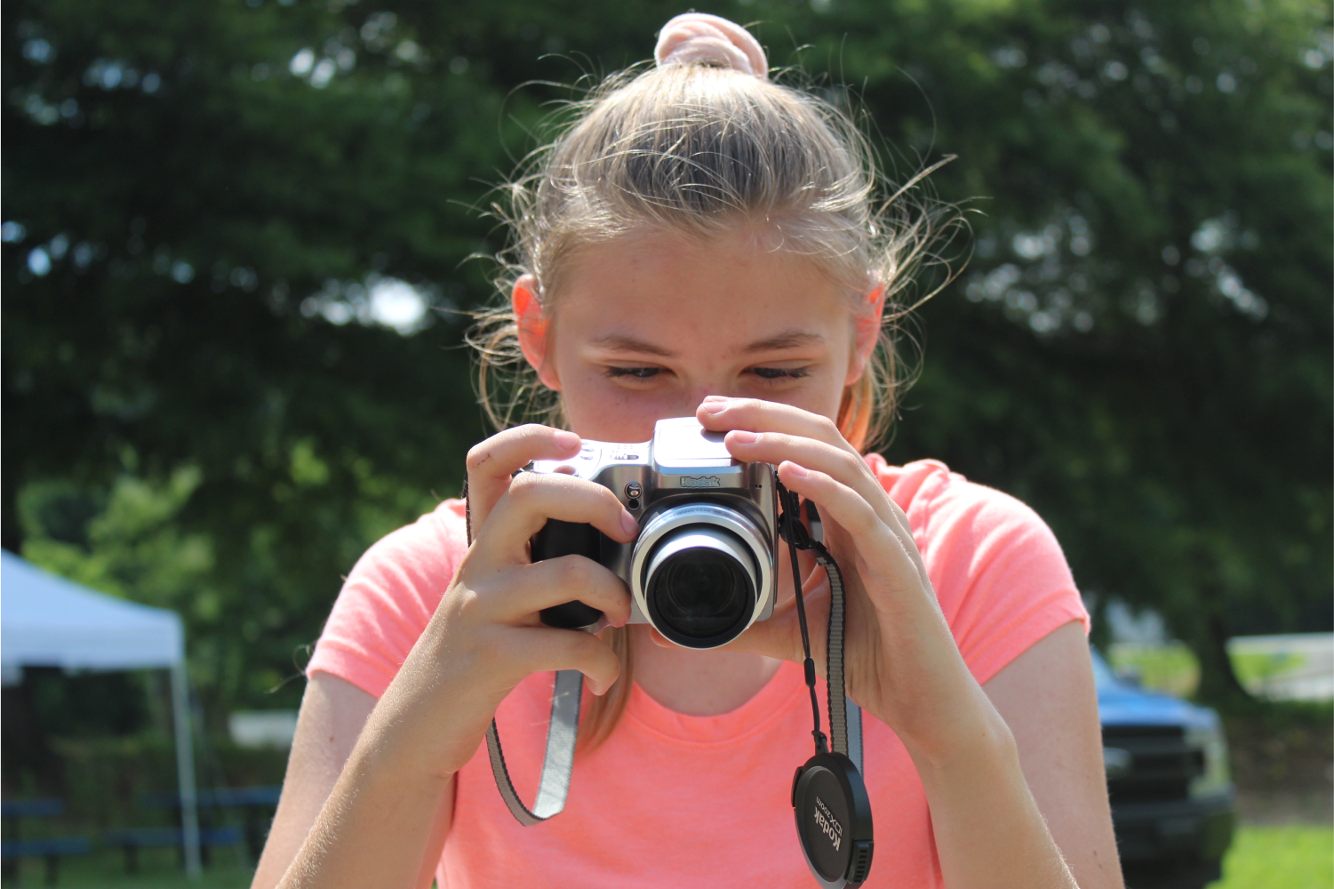 PAGE girl taking a photograph