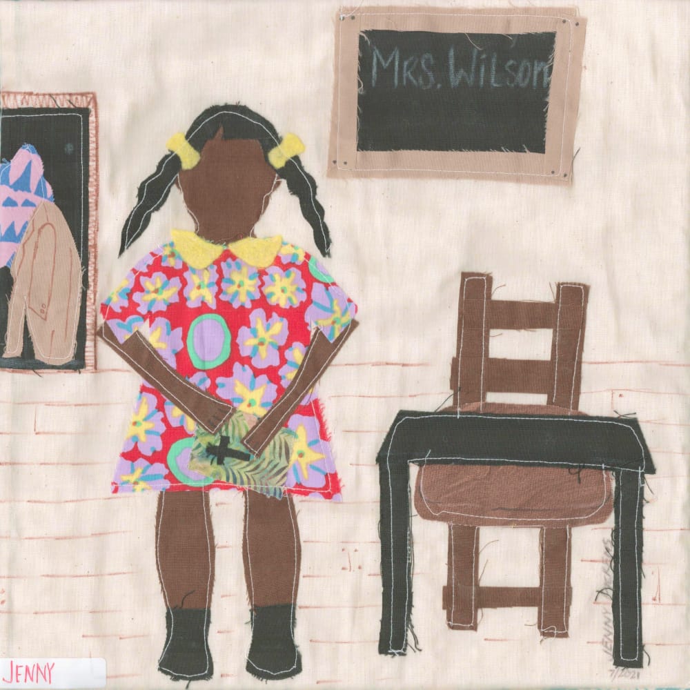 A quilt square depicting an African American girl in a red floral dress. She's in a classroom, next to a desk and chair.