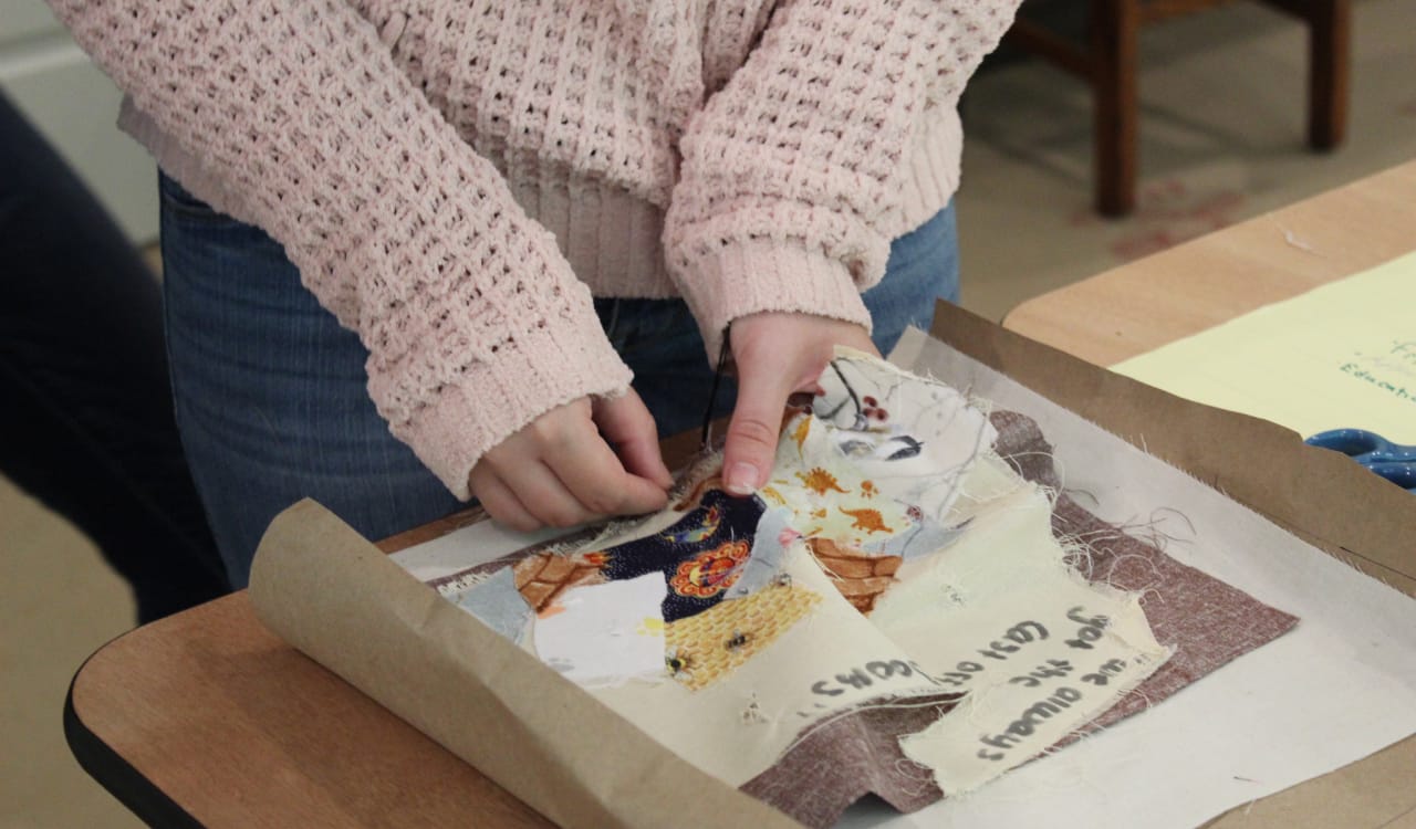 Katlyn working on her quilt square