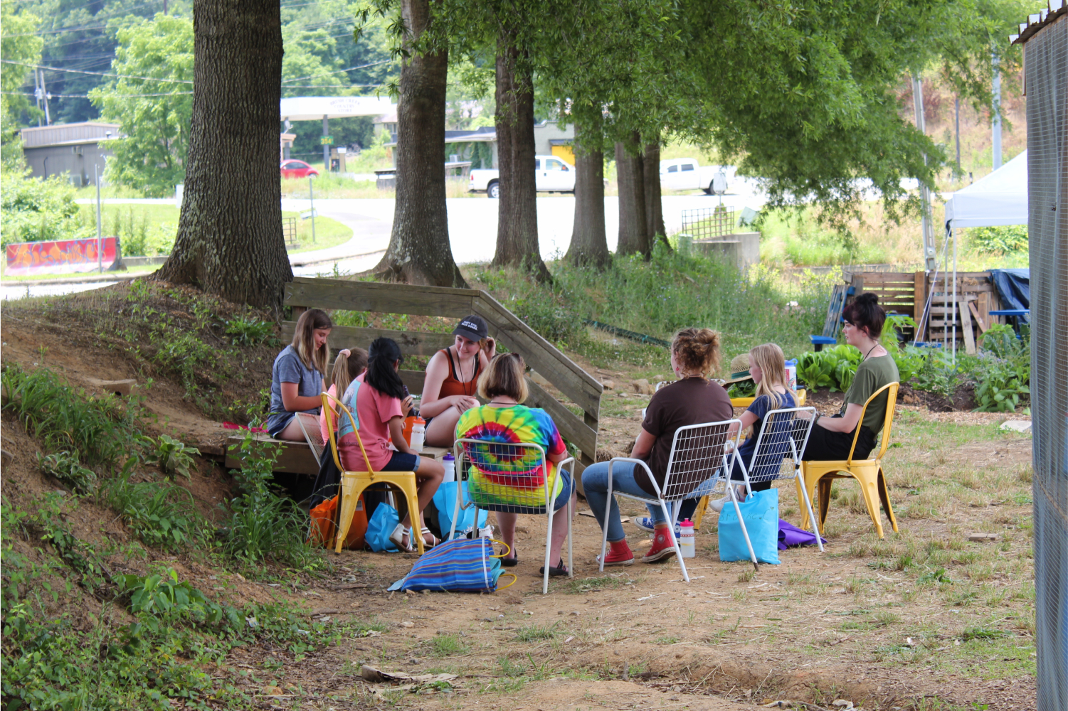 A group of PAGE girls sitting in a circle outdoors