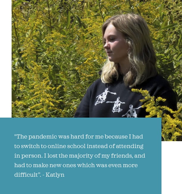 Katlyn stands in a field of yellow goldenrod, looking off into the distance.